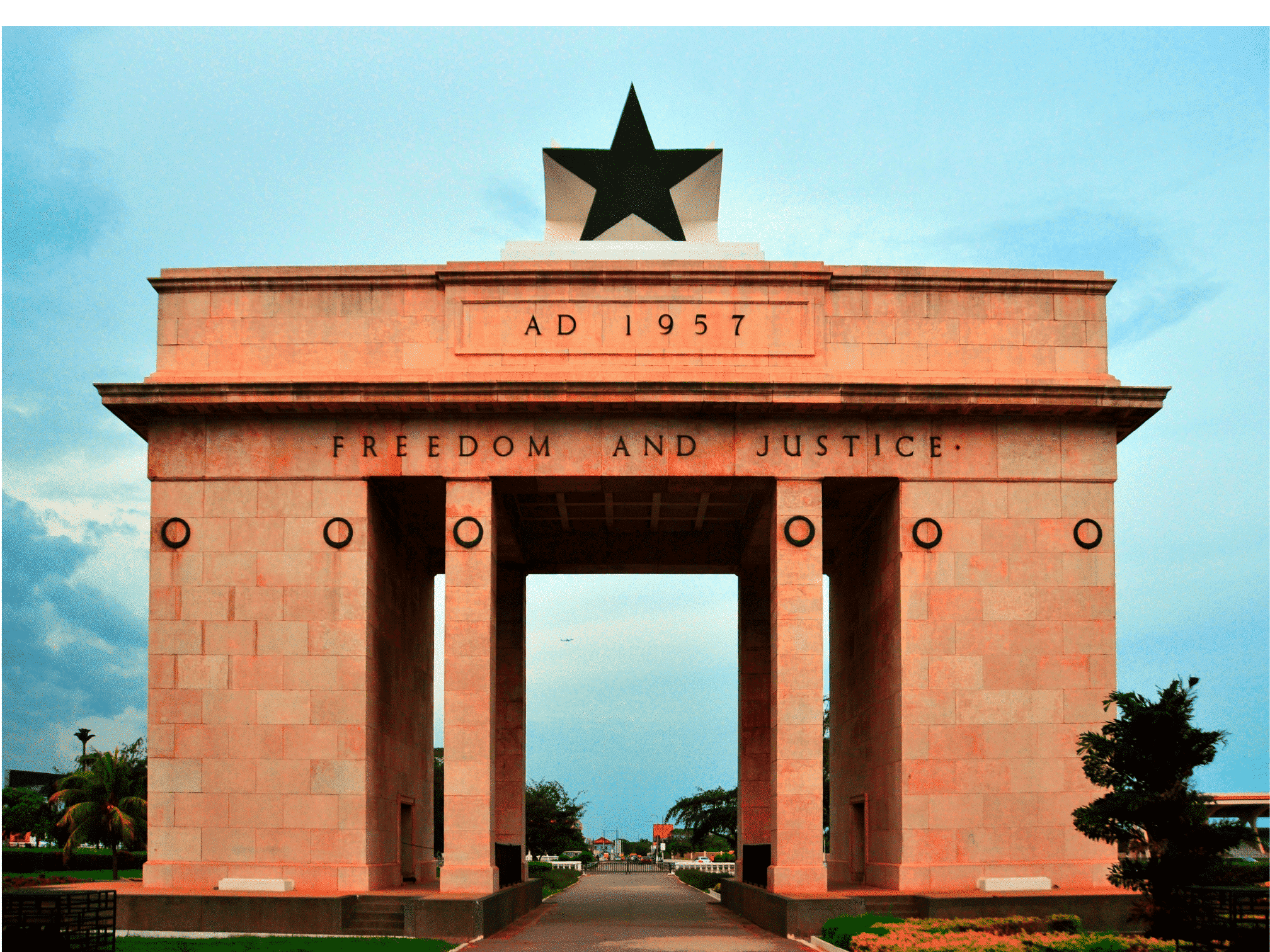 Black Star Gate - a large brick gate in Accra, Ghana with a black star at the top. The monument bears the large inscription “AD 1957” and “Freedom and Justice”.