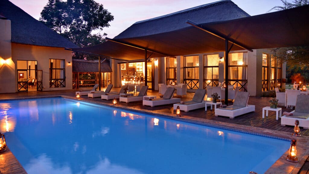 1733934477728 safari plains pool deck at night