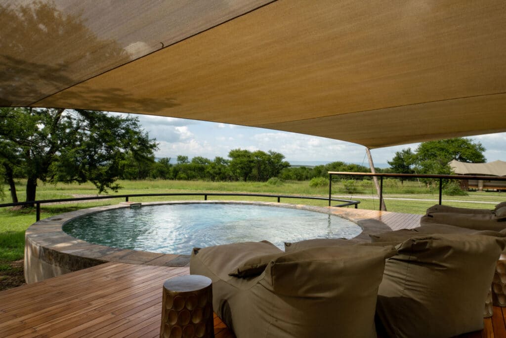 Asilia Africa Sayari Retreat Loungers at Swimming Pool in shared Main Area
