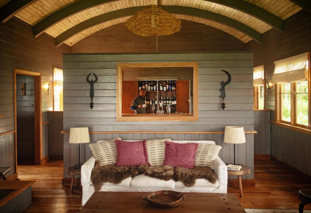 Sundowners are poured in the bar at Entamanu