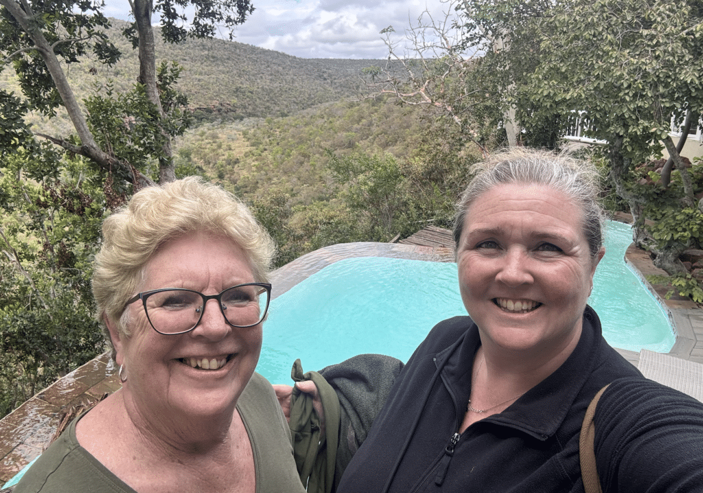 Sarah and Sue beside the communal swimming pool at Clifftop